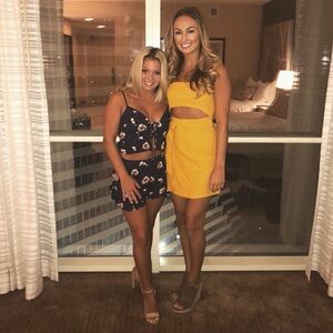 Cute golden yellow wrap dress with tie and mid riff cutout!